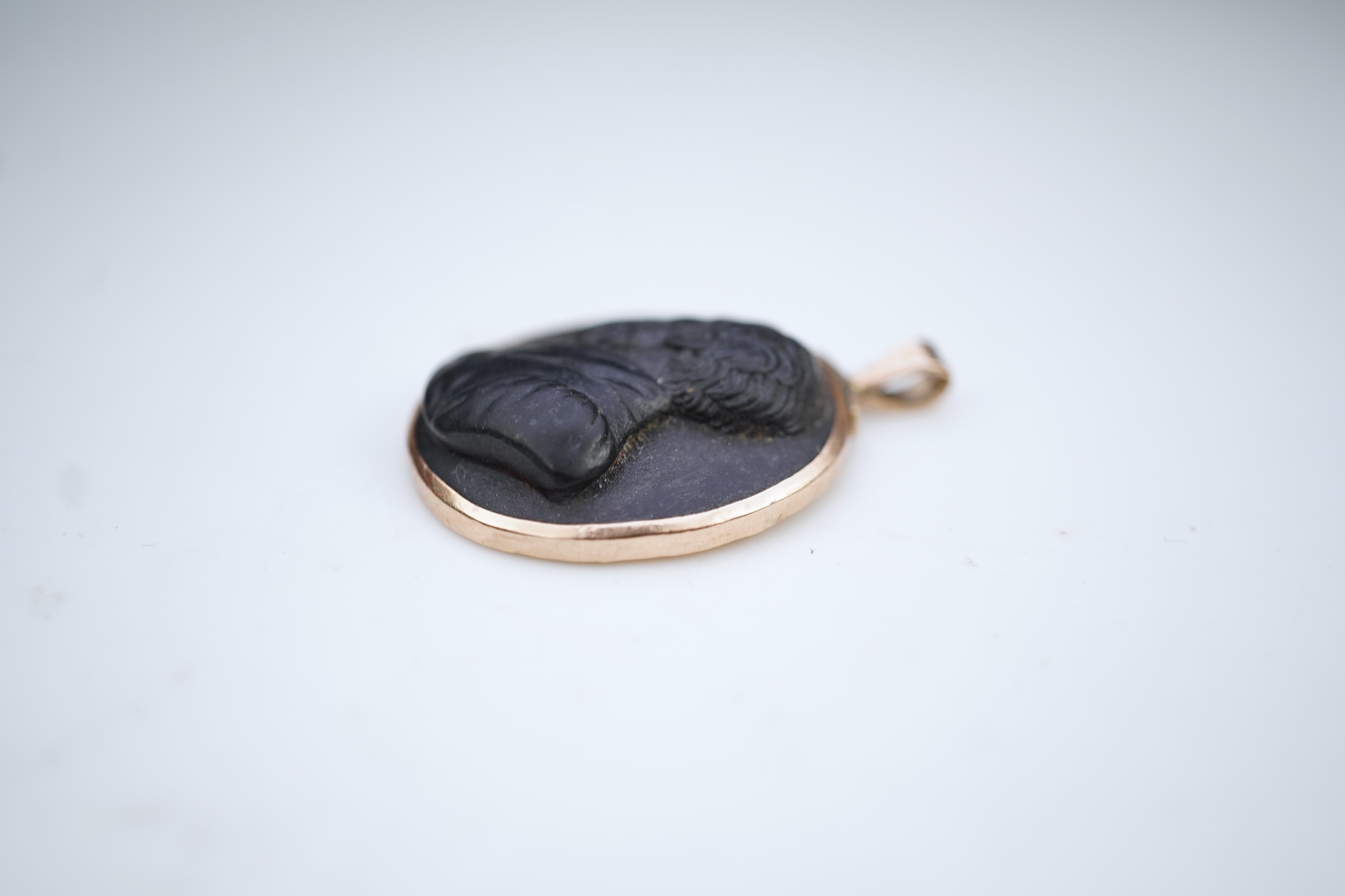An unusual lava cameo pendant, late 19th century
